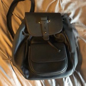 New without tags bucket style backpack. Faux leath